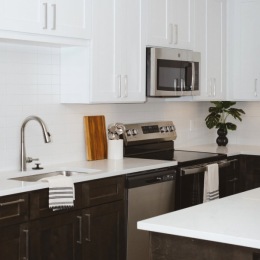 a kitchen with white cabinets